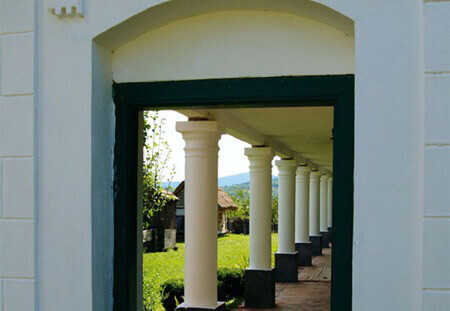Hallway with White Pillars